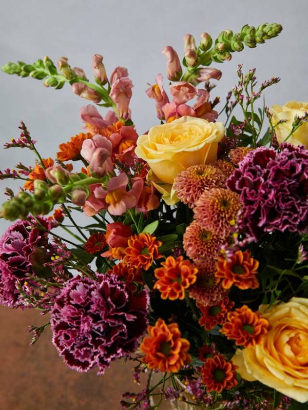 Bouquet Joy dark carnations, yellow roses and pom pom daisies